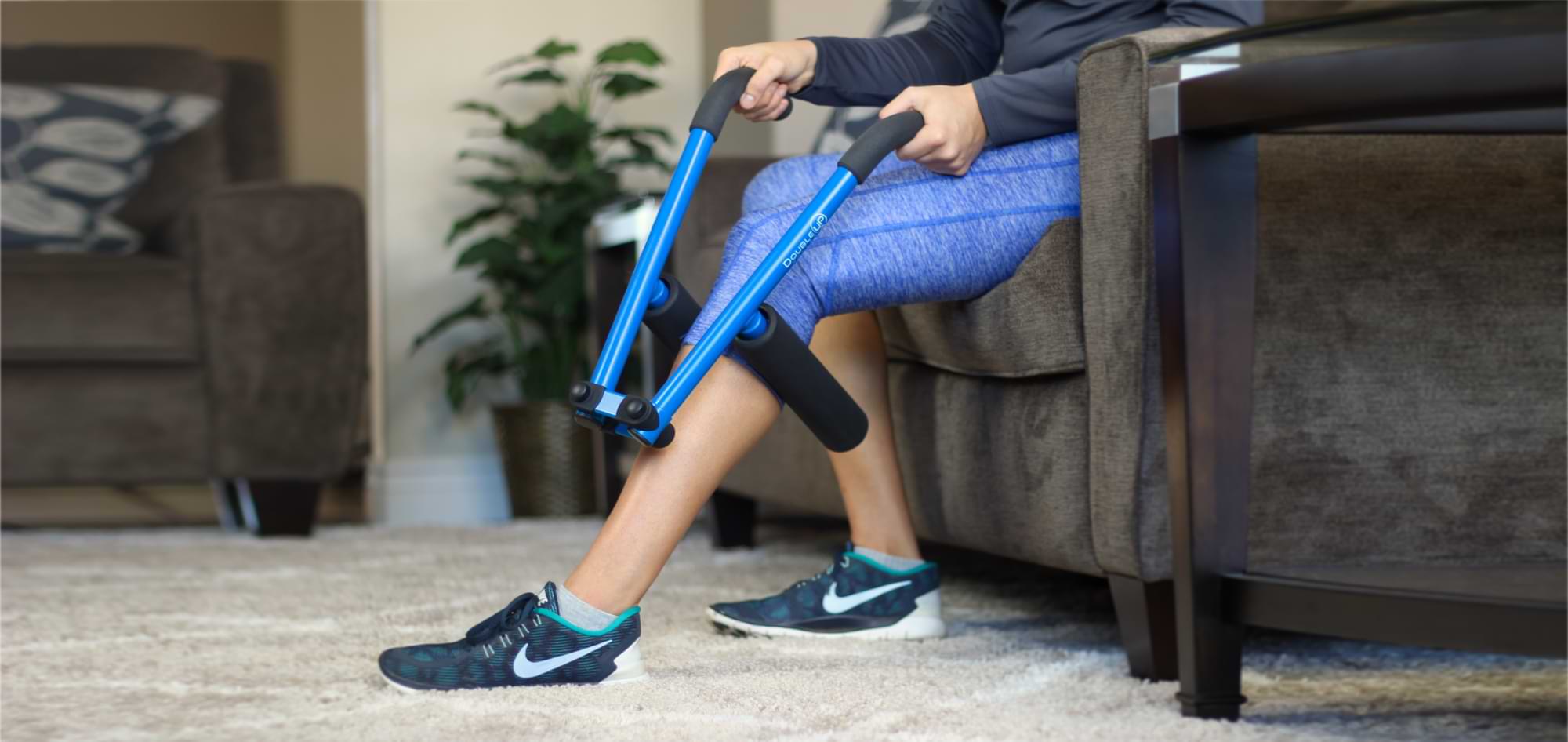 DoubleUP Roller used on calf while seated on a sofa