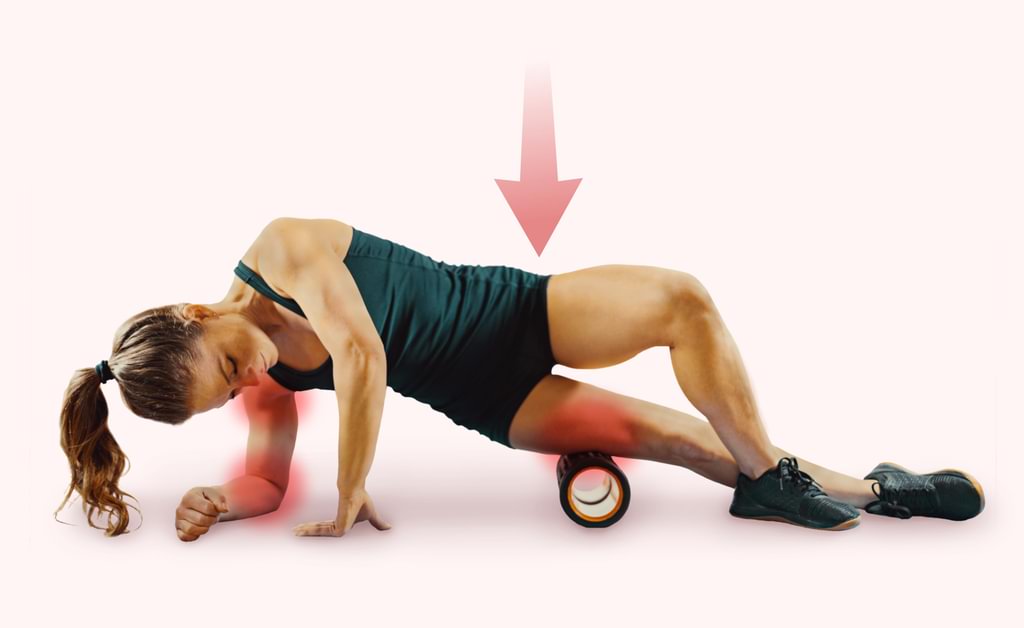 Woman painfully laying on a traditional foam roller
