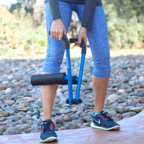 Female runner rolling her legs with DoubleUP frame loaded with WarmUP smooth soft-density foam rollers.